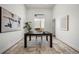 Minimalist office space with a large desk, modern art, and natural light at 3485 S Clermont St, Denver, CO 80222