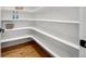 Spacious pantry with wooden floors and multiple shelves at 3485 S Clermont St, Denver, CO 80222