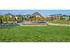 Community amphitheater with a stage and lawn seating for outdoor events and concerts at 5439 Verbena St, Denver, CO 80238