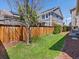 Well-maintained backyard featuring a lush lawn and a privacy fence, perfect for outdoor enjoyment at 5439 Verbena St, Denver, CO 80238