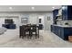 Finished basement features a kitchenette and dining area with views of a bathroom and recreation area at 5439 Verbena St, Denver, CO 80238