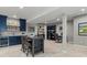 Finished basement with a kitchenette, dining area, workstation, and carpeting throughout at 5439 Verbena St, Denver, CO 80238