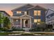 Charming two-story home with landscaped front yard, inviting porch, stone accents, and professionally maintained lawn at 5439 Verbena St, Denver, CO 80238
