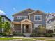 Charming two-story home with well-maintained lawn, stone accents, covered porch, and inviting curb appeal at 5439 Verbena St, Denver, CO 80238