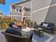 Outdoor patio with comfortable seating, an umbrella, and a grill, ideal for relaxation and entertaining at 5439 Verbena St, Denver, CO 80238