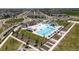 Community pool area with a waterslide and plenty of lounge chairs for residents at 5439 Verbena St, Denver, CO 80238