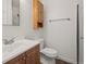 Clean bathroom with shower/tub and wood vanity at 5547 S Lowell Blvd, Littleton, CO 80123