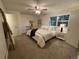 Main bedroom with plush bed, ceiling fan, and ample closet space at 5547 S Lowell Blvd, Littleton, CO 80123