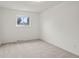 Spacious bedroom with neutral carpeting and window at 5547 S Lowell Blvd, Littleton, CO 80123