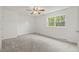 Spacious bedroom with neutral carpeting and large window at 5547 S Lowell Blvd, Littleton, CO 80123