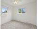 Well-lit bedroom with neutral carpeting and window at 5547 S Lowell Blvd, Littleton, CO 80123