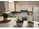 Bright kitchen with white cabinets and new appliances at 5547 S Lowell Blvd, Littleton, CO 80123