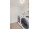 Bright laundry room, featuring washer, dryer, and ample shelving at 5547 S Lowell Blvd, Littleton, CO 80123