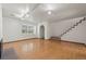 Spacious living room with hardwood floors and staircase at 5547 S Lowell Blvd, Littleton, CO 80123