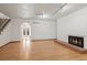 Living room with hardwood floors, fireplace, and view to backyard at 5547 S Lowell Blvd, Littleton, CO 80123