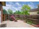 Private patio with brick pavers and flowering plants at 5547 S Lowell Blvd, Littleton, CO 80123