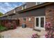 Shared patio with brick pavers and rose bushes at 5547 S Lowell Blvd, Littleton, CO 80123