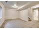 Finished carpeted basement area with stairs to upper level and window at 11213 Vilas St, Parker, CO 80134