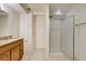 Bathroom featuring a granite vanity, shower with glass doors and tile flooring at 11213 Vilas St, Parker, CO 80134