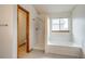 Bathroom boasts a bathtub with shower, and a window letting in light at 11213 Vilas St, Parker, CO 80134