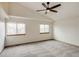 Spacious bedroom with vaulted ceiling, ceiling fan, and large windows for ample natural light at 11213 Vilas St, Parker, CO 80134