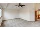 Neutral bedroom with gray carpet, ceiling fan and window letting in light at 11213 Vilas St, Parker, CO 80134