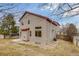 Back exterior of home featuring neutral siding, red trim, and yard at 11213 Vilas St, Parker, CO 80134