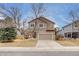 Charming two-story home features a two-car garage and well-maintained front yard at 11213 Vilas St, Parker, CO 80134