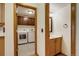 Combination view showing washer and dryer plus nearby bathroom with sink and mirror at 11213 Vilas St, Parker, CO 80134