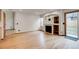 Bright living room with hardwood floors, fireplace, and sliding glass door at 11213 Vilas St, Parker, CO 80134