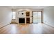 Bright living room with hardwood floors, fireplace, and sliding glass door at 11213 Vilas St, Parker, CO 80134