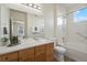 Clean bathroom with double vanity and bathtub shower combo at 14343 E 1St Dr # 202, Aurora, CO 80011