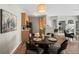 View of dining area, kitchen with wood cabinets, and living room with fireplace at 14343 E 1St Dr # 202, Aurora, CO 80011