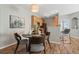 Dining room with a round table and four chairs, next to the kitchen at 14343 E 1St Dr # 202, Aurora, CO 80011