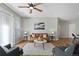 Living room with hardwood floors, a brown leather couch, and a coffee table at 14343 E 1St Dr # 202, Aurora, CO 80011