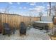 Inviting backyard with a hot tub, fire pit, and seating area at 1085 N Wolff St, Denver, CO 80204