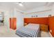 Bedroom features white walls, two-tone accent wall, carpet and closet with bedside tables at 1885 S Quebec Way # C15, Denver, CO 80231