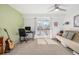 Well-lit room with neutral paint, carpet, desk and a sliding door leading to the deck at 1885 S Quebec Way # C15, Denver, CO 80231