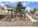 Community playground area with slides, climbers, and swings at 1885 S Quebec Way # C15, Denver, CO 80231