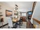 Inviting dining area flows into the living room, featuring a modern table and stylish decor at 8735 W Cornell Ave # 7, Lakewood, CO 80227