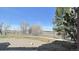Scenic backyard view with trees and a walking trail, perfect for enjoying nature and outdoor activities at 14333 E 1St Dr # 108, Aurora, CO 80011