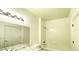 Classic bathroom features a shower over tub and single sink granite vanity at 14333 E 1St Dr # 108, Aurora, CO 80011