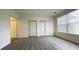 Spacious bedroom with multiple closets, new floors, and bright natural light at 14333 E 1St Dr # 108, Aurora, CO 80011