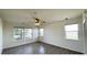 Bright and airy bedroom with hardwood floors, ceiling fan, and large windows at 14333 E 1St Dr # 108, Aurora, CO 80011