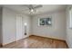 This bright bedroom has a ceiling fan, large windows, and a spacious closet at 180 Dover St, Lakewood, CO 80226