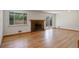 Bright living room featuring hardwood floors, fireplace, and sliding glass door leading to the outdoors, offering great flow at 180 Dover St, Lakewood, CO 80226