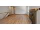 Spacious living room featuring hardwood floors and brick fireplace at 180 Dover St, Lakewood, CO 80226