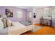 Cozy bedroom features beautiful natural light, desk, and a mirrored closet at 1605 17Th St, Boulder, CO 80302