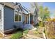 Beautiful exterior of a blue house featuring a garden area, porch, and a charming design at 1605 17Th St, Boulder, CO 80302