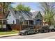 Charming two-story home with a well-manicured front yard and inviting curb appeal on a sunny day at 1605 17Th St, Boulder, CO 80302